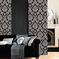 Patterned mocha coloured panel blinds in a living room setting.