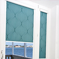 Intu patterned blind in turquoise.