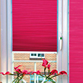 Intu duette blinds in bright pink.