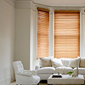 Tuscan oak venetian blind in a living room setting.